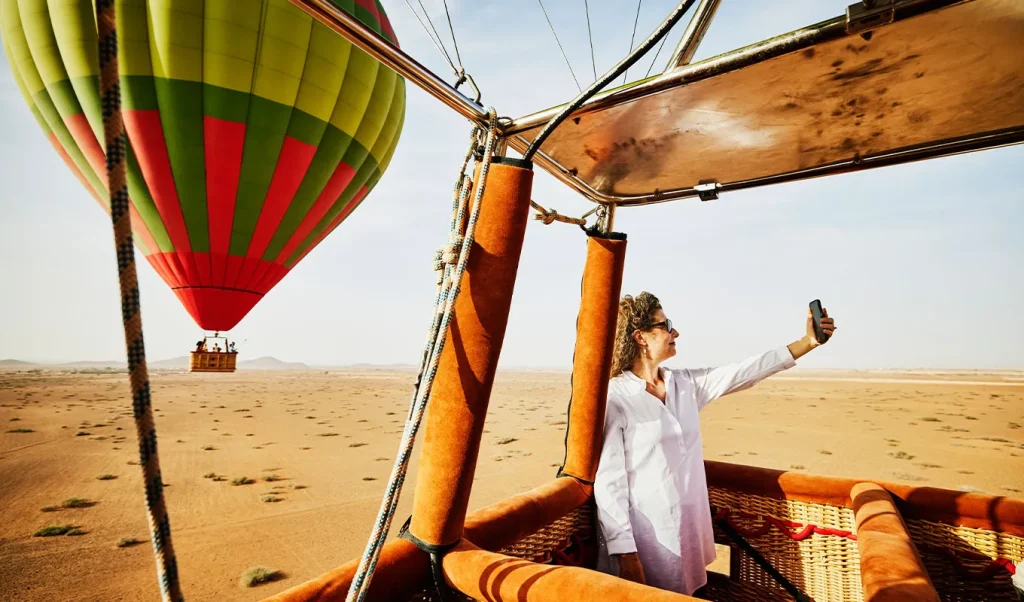 Hot air balloon over the desert near Merzouga on the 3 day Merzouga tour from Errachidia